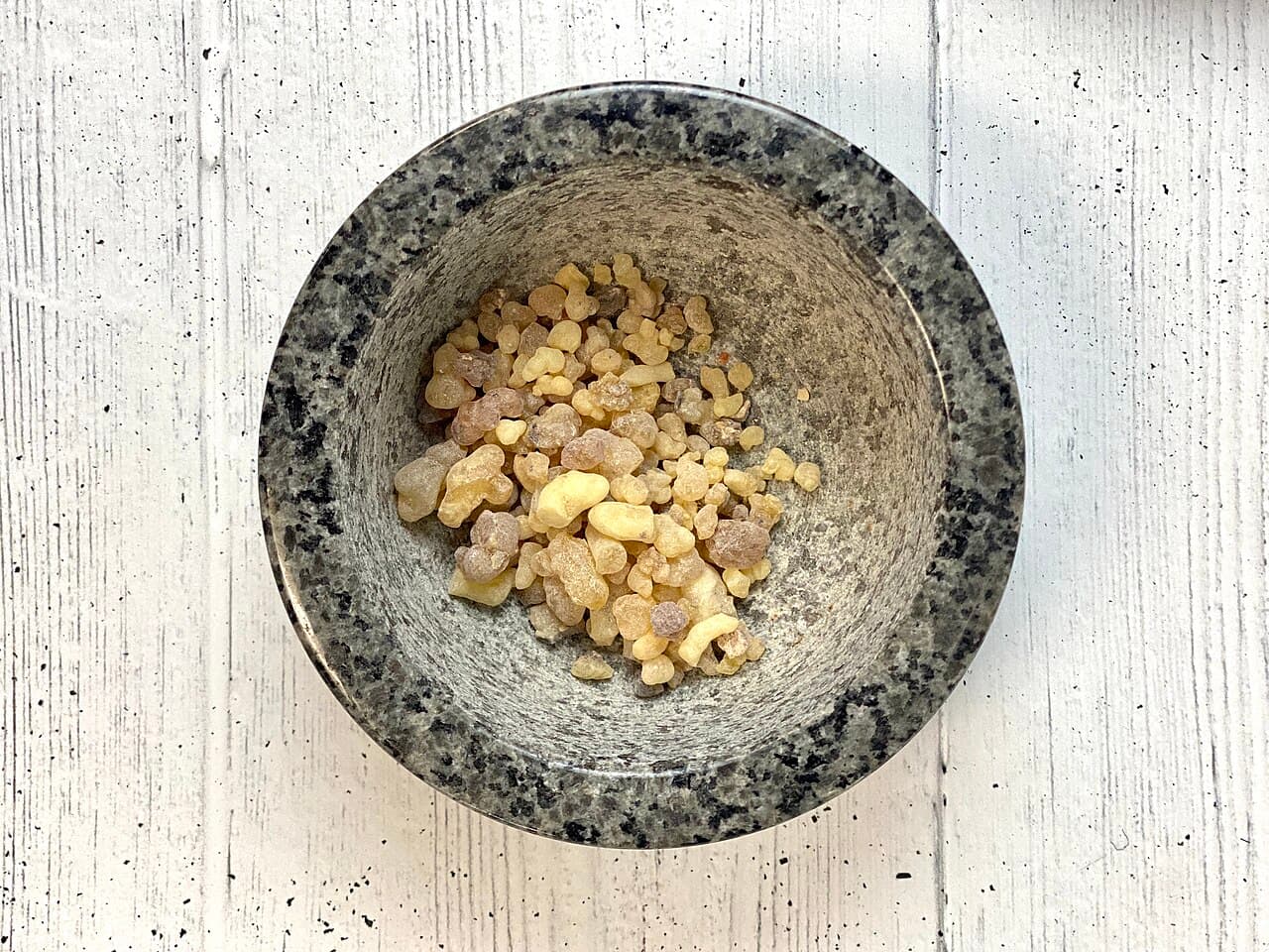 Natural herbal resin in a stone mortar